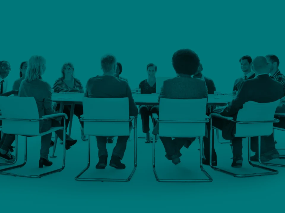 Business people gathered around a conference table