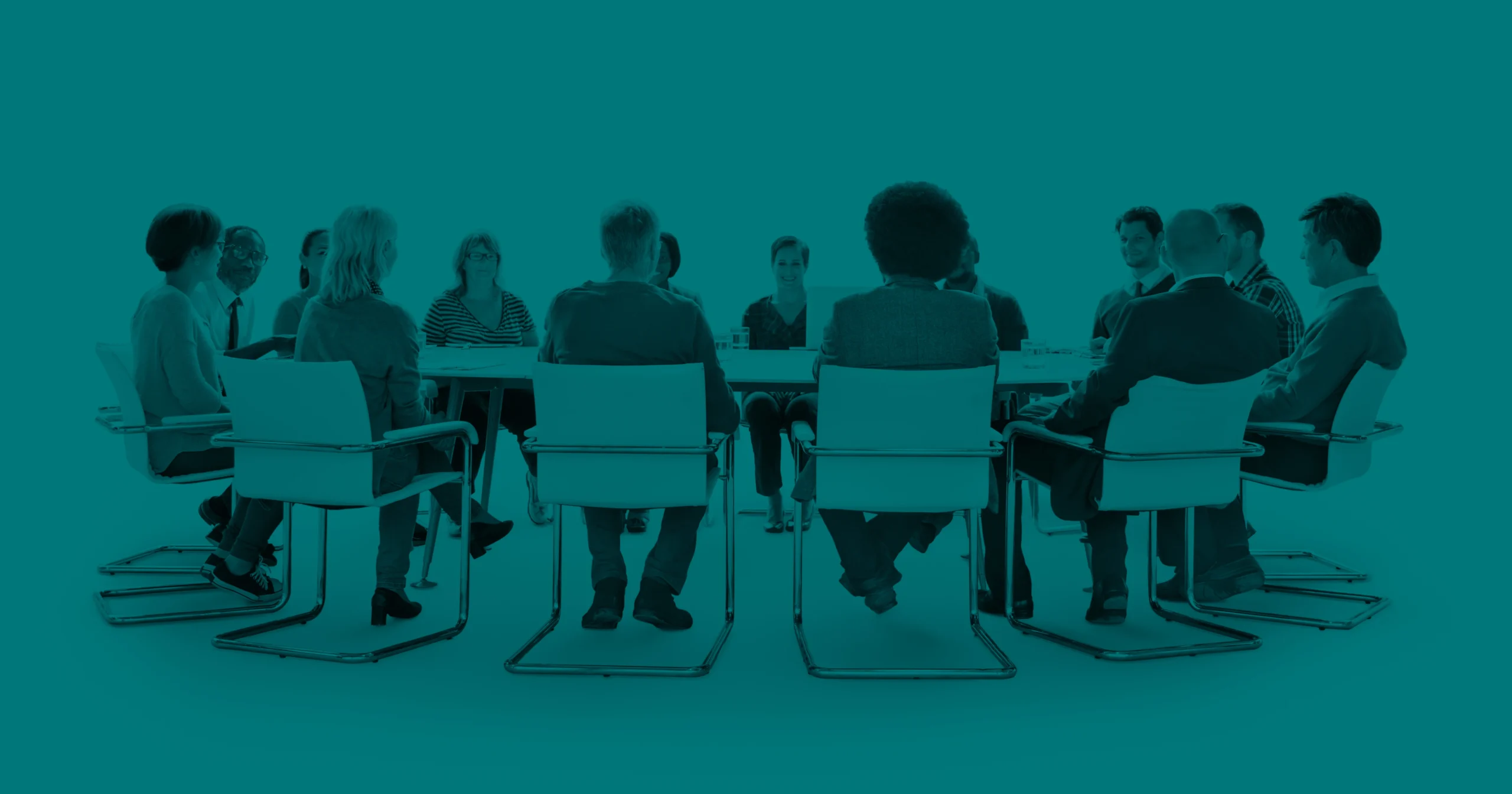 Business people gathered around a conference table